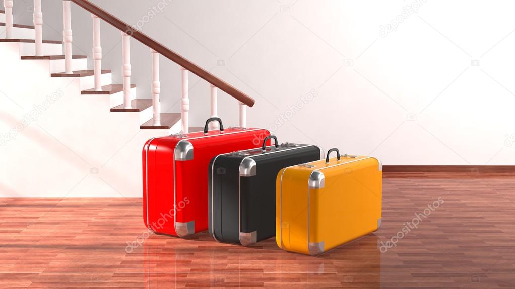 Suitcases beside stairs with white blank wall for copy-space