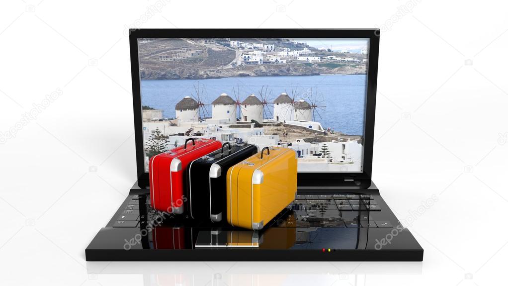 Suitcases on black laptop keyboard with Greek island on screen, isolated
