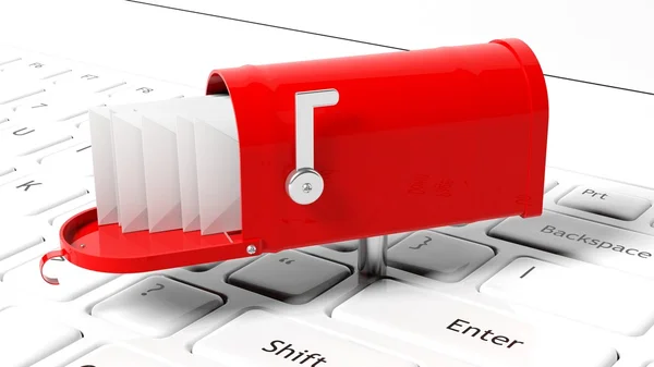 Rode mailbox met met enveloppen op witte laptop toetsenbord — Stockfoto