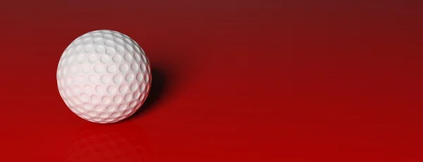 Golfbal, geïsoleerd op rode achtergrond — Stockfoto