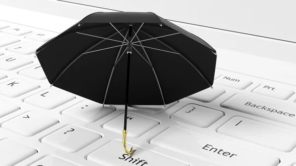 Guarda-chuva preto no teclado do laptop branco — Fotografia de Stock