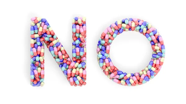 Cápsulas coloridas em forma de palavra Não, isoladas sobre fundo branco . — Fotografia de Stock