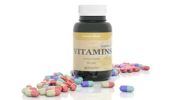 Barevné kapsle vitamíny a láhev, izolovaných na bílém pozadí. — Stock fotografie