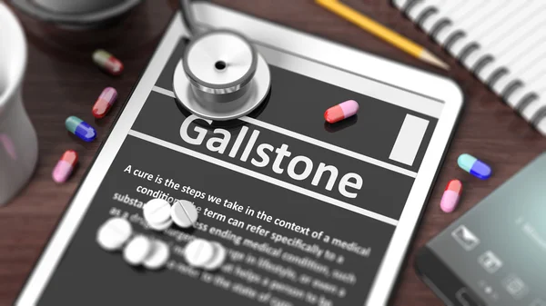 Comprimido com "Gallstone" na tela, estetoscópio, pílulas e objetos na área de trabalho de madeira . — Fotografia de Stock