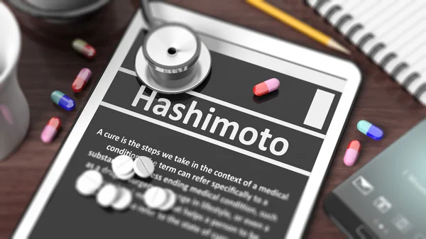 Tablet with "Hashimoto" on screen, stethoscope, pills and objects on wooden desktop. — Stock Photo, Image