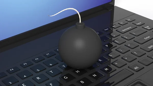 Black cannonball bomb on black laptop keyboard. — Stockfoto