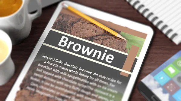 Tabletop mit verschiedenen Objekten auf Tablet mit Rezept von "Brownie" auf dem Bildschirm konzentriert — Stockfoto