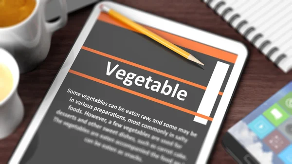 Plateau avec divers objets centrés sur la tablette avec le contenu "Légumes" à l'écran — Photo