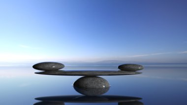 Zen taş suda ıslatın ve mavi gökyüzü ve huzurlu manzara Dengeleme.