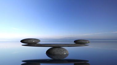 Balancing Zen stones in water with blue sky and peaceful landscape. clipart
