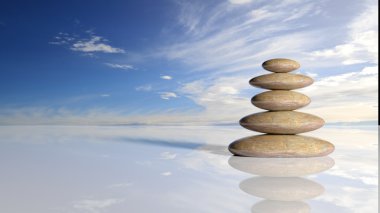 Zen taş yığınından büyük su huzurlu gökyüzü bulutlu yansıtan küçük.