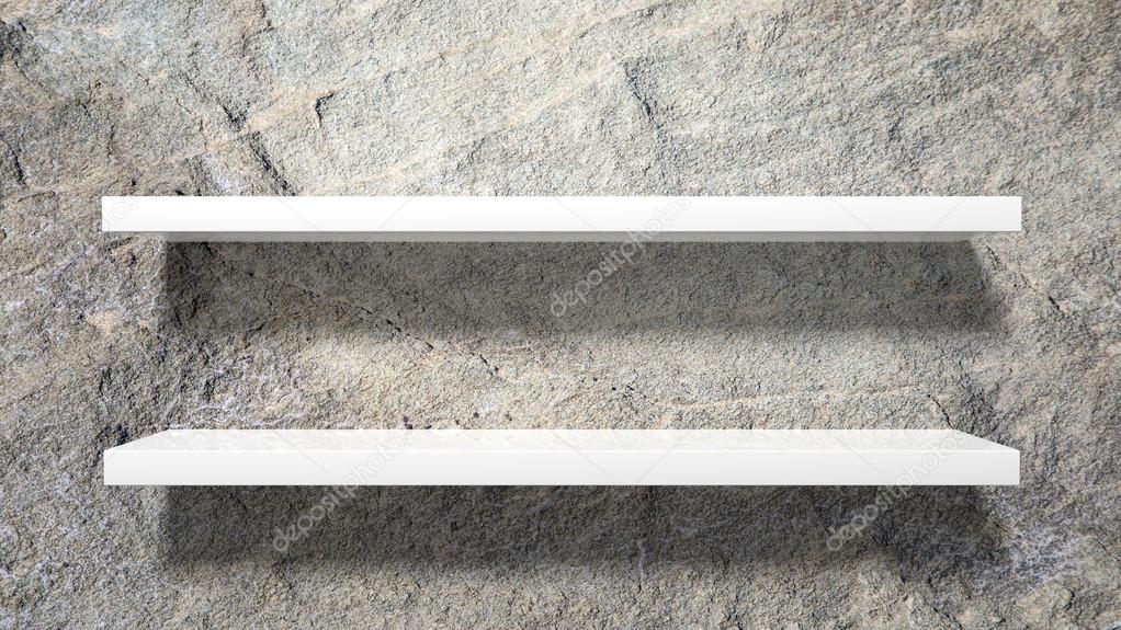 Two empty white wall shelves on stone wall.