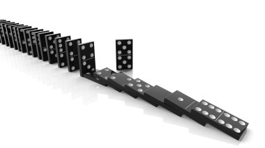 Black domino tiles falling in a row with some standing, isolated on white