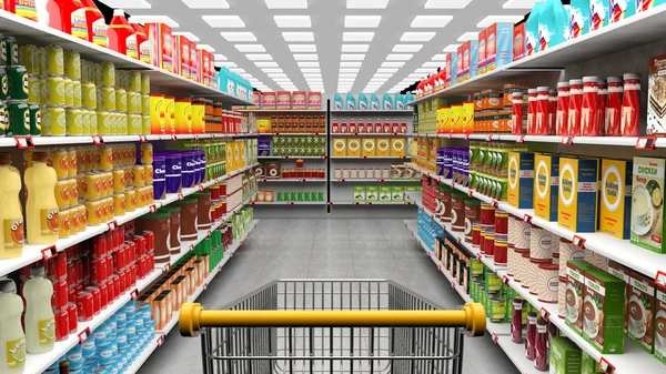 Supermarket interior with shelves full of various products and empty trolley basket — Stock Photo, Image