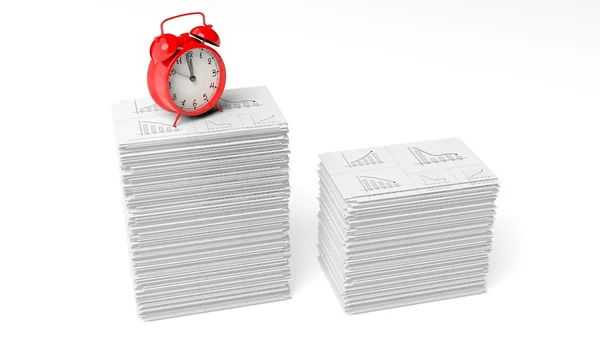 Cloack de alarme vermelho em uma pilha de papelada com gráficos, isolado em fundo branco . — Fotografia de Stock