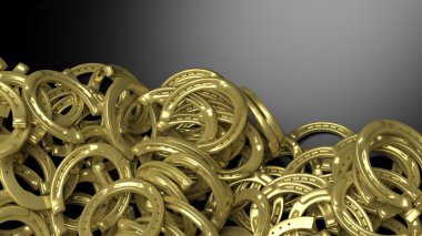 Golden horseshoe pile abstract background with copy-space