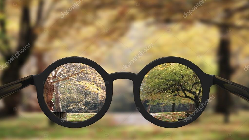 Closeup on eyeglasses with focused and blurred landscape view. Stock