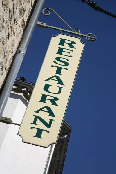 Yellow Restaurant Sign on Blue Sky — Stock Photo, Image