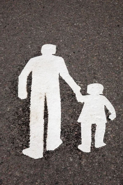 Символ семьи на тротуаре — стоковое фото