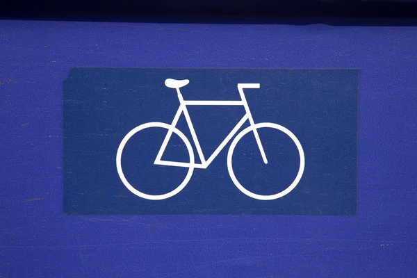 Sinal de bicicleta em azul e branco — Fotografia de Stock