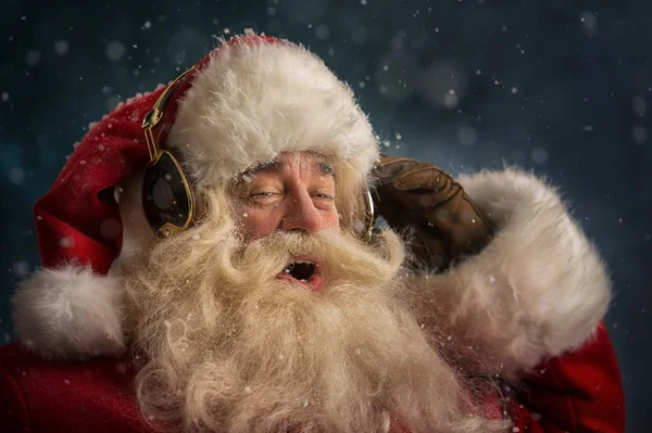 Santa Claus is listening music — Stock Photo, Image