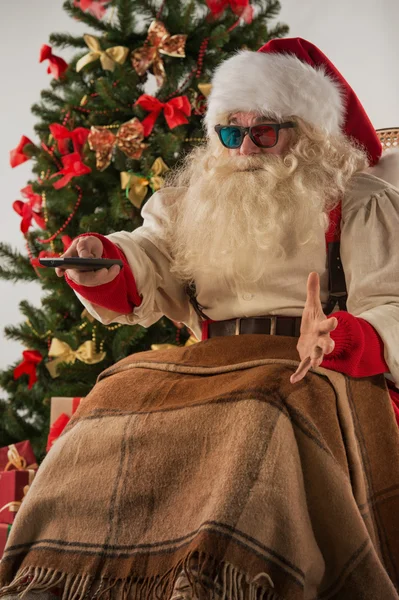 Santa Claus sentado cerca del árbol de Navidad —  Fotos de Stock