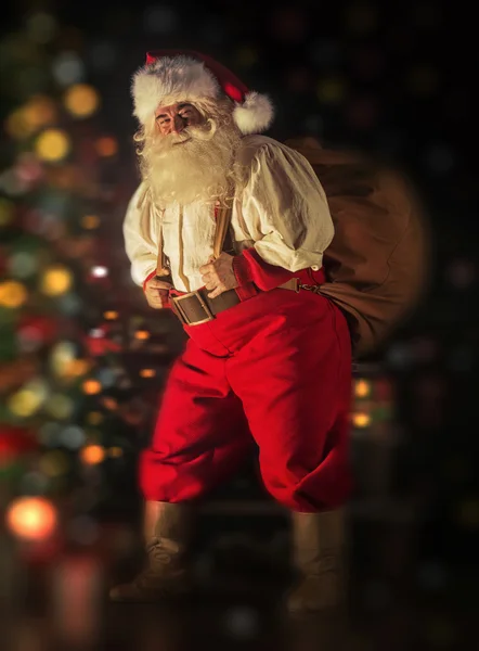 Santa Claus carrying huge sack — Stock Photo, Image