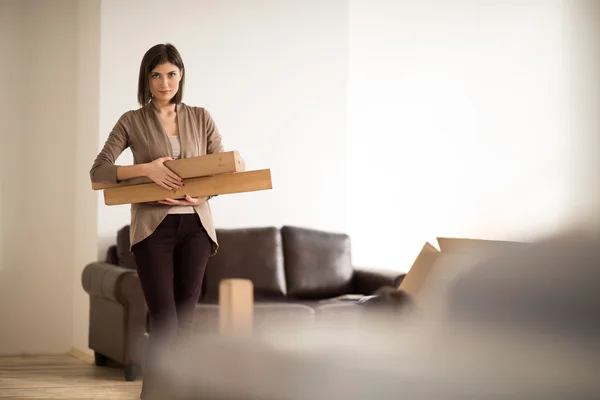 Woman holding a cardboard box — Stock Photo, Image