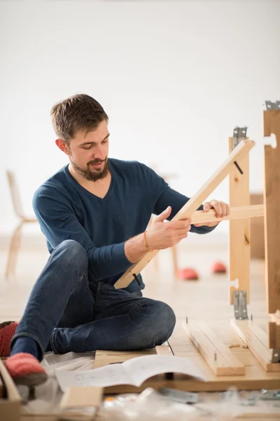 Man Putting Self Assembly Furniture — Stock Image Man Putting Self Assembly Furniture Stock Image