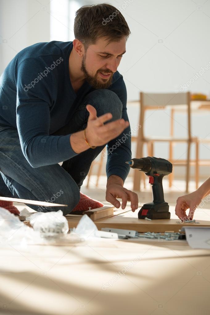Man Putting  Self Assembly Furniture