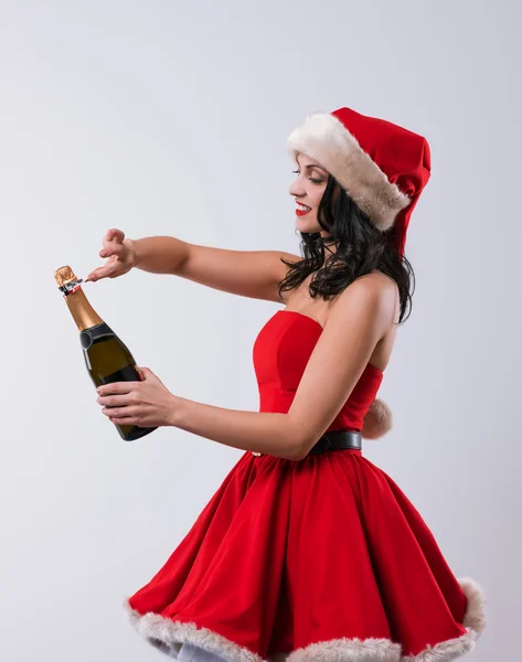 Vrouw met champagne fles — Stockfoto