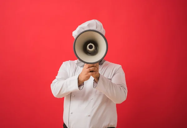 Homem de uniforme chef com megafone — Fotografia de Stock