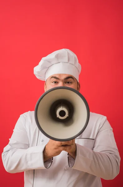 Hombre en uniforme de chef con megáfono —  Fotos de Stock