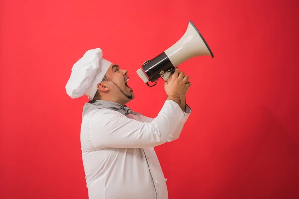 Man in chef uniform with megaphone — Stock Photo, Image