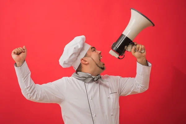 Homem de uniforme chef com megafone — Fotografia de Stock