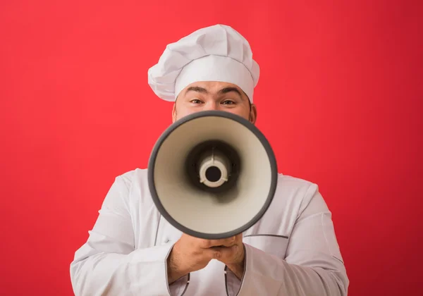 Człowiek w jednolity z megafon kuchni — Zdjęcie stockowe