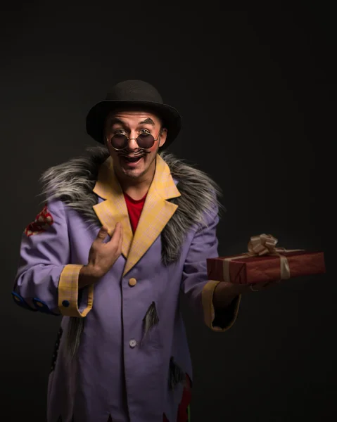 Clown with Christmas gifts — Stock Photo, Image