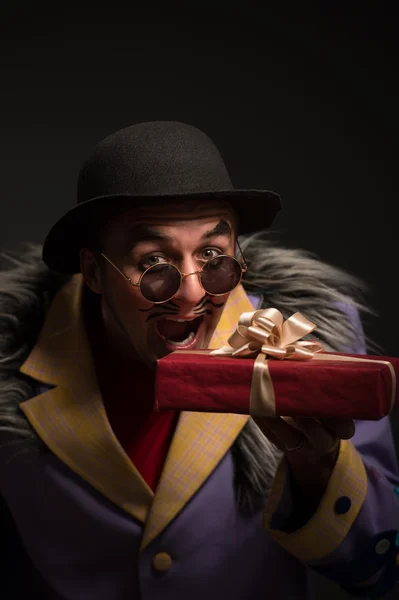 Clown with Christmas gifts — Stock Photo, Image