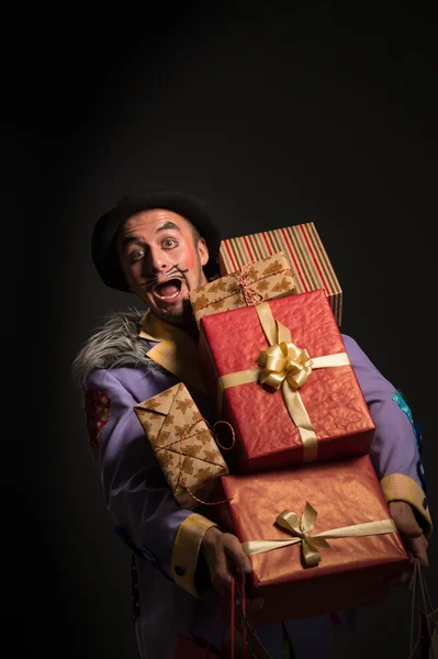 Clown with Christmas gifts — Stock Photo, Image