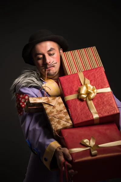 Clown with Christmas gifts — Stock Photo, Image