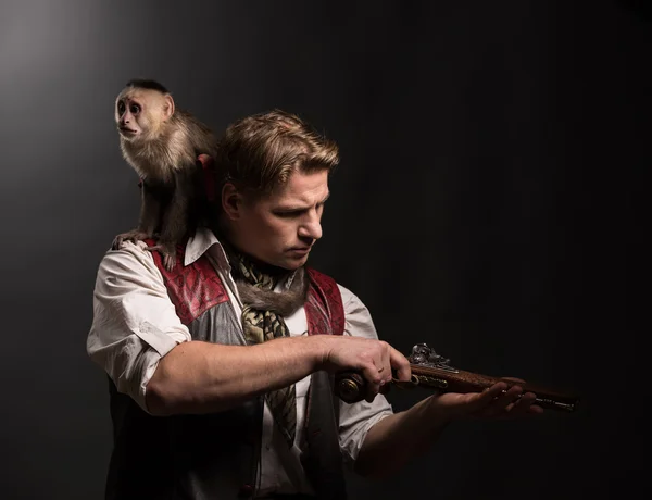 Man adventurer with monkey companion — Stock Photo, Image