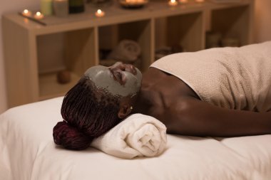 African woman  in spa salon clipart