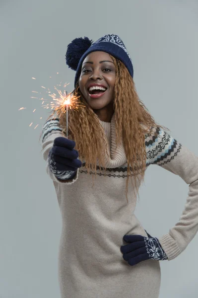 Woman holding sparkler — Stock Photo, Image