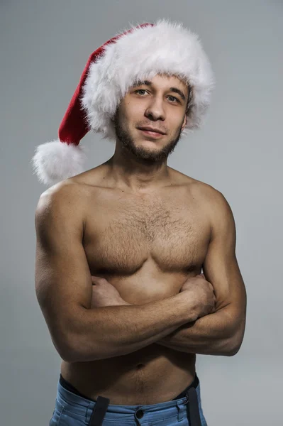 Homem sexy no chapéu de Papai Noel — Fotografia de Stock