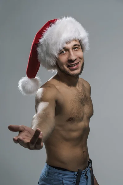 Homem sexy no chapéu de Papai Noel — Fotografia de Stock