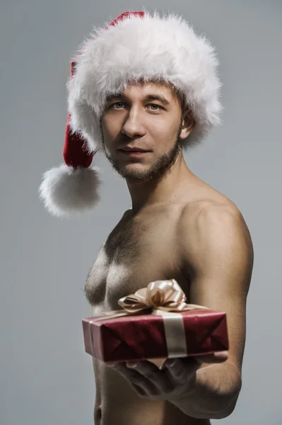 Sexo homem no Papai Noel chapéu — Fotografia de Stock