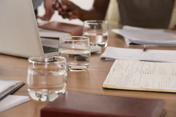 Glasses of water  at meeting — Stock Photo, Image