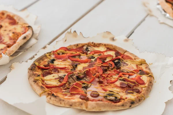 Italian pizzas on table — Stock Photo, Image