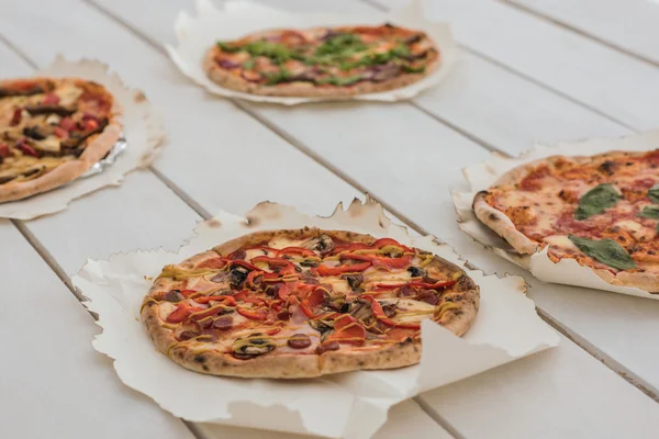 Italian pizzas on table — Stock Photo, Image