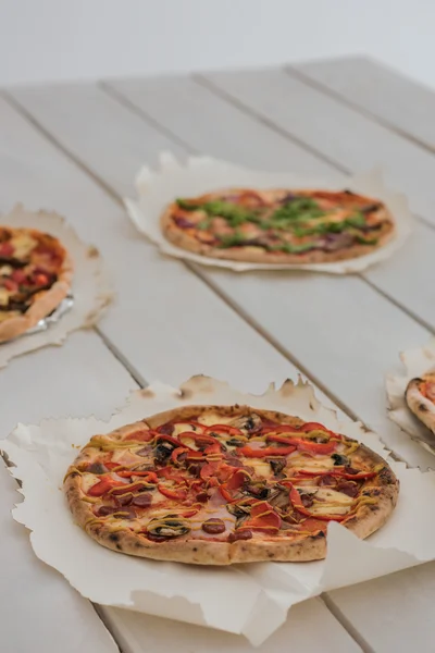 Italian pizzas on table — Stock Photo, Image